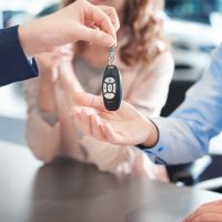close-up-of-car-keys-passing-to-customers-hands